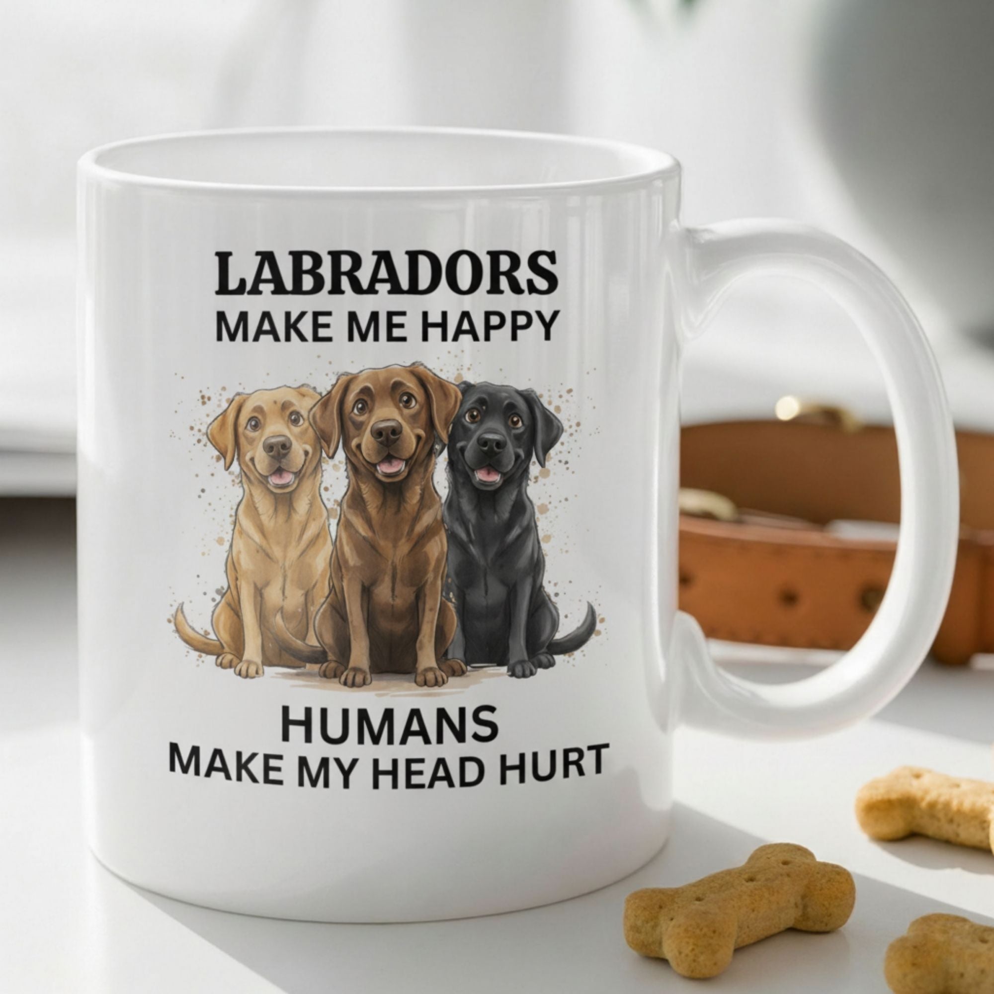 White mug with Labrador illustrations and text on a surface with dog treats.